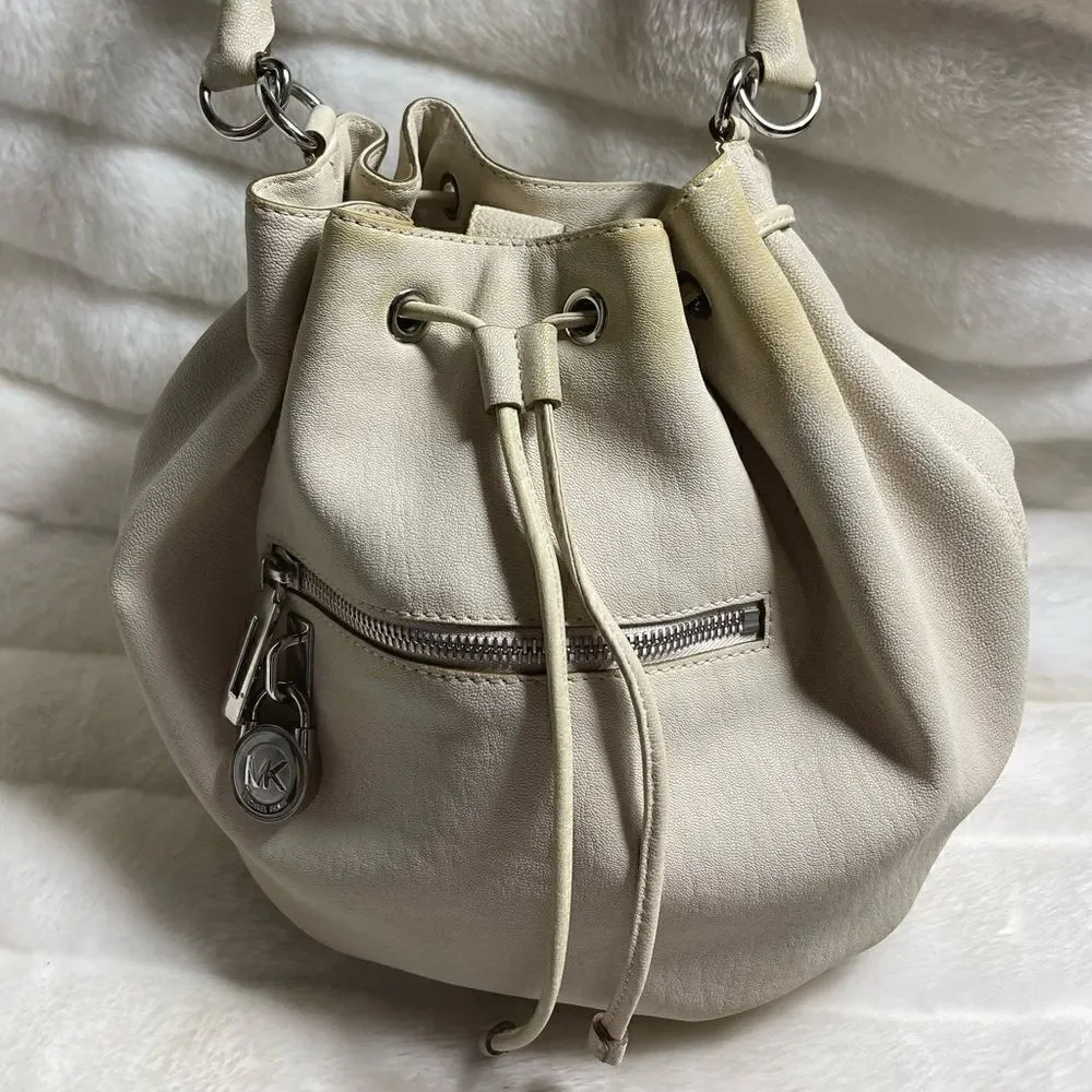 Michael Michael Kors leather beige drawstring bucket satchel.silver tone accents